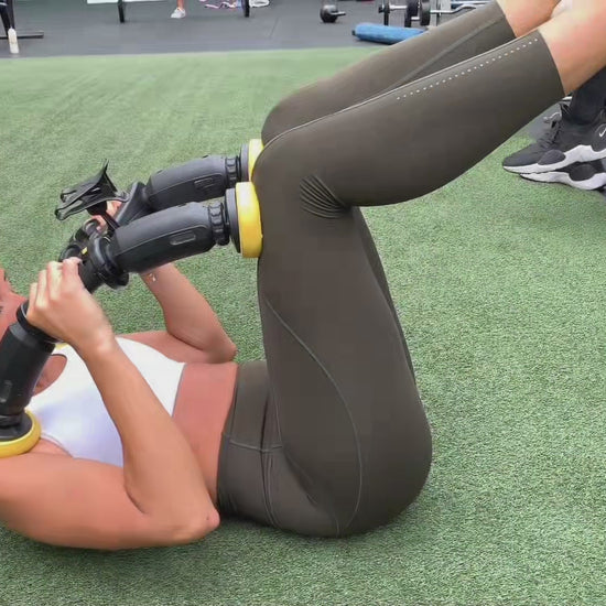 standard--abxcore ab trainer woman using device 