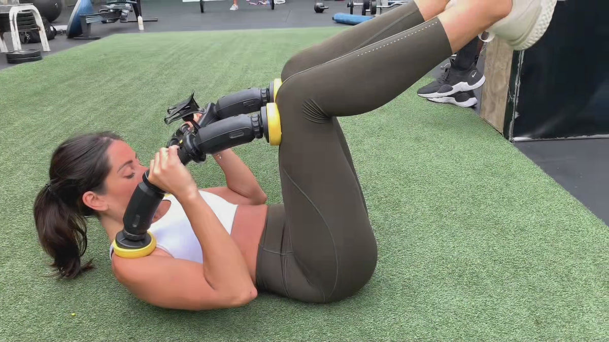 standard--abxcore ab trainer woman using device 